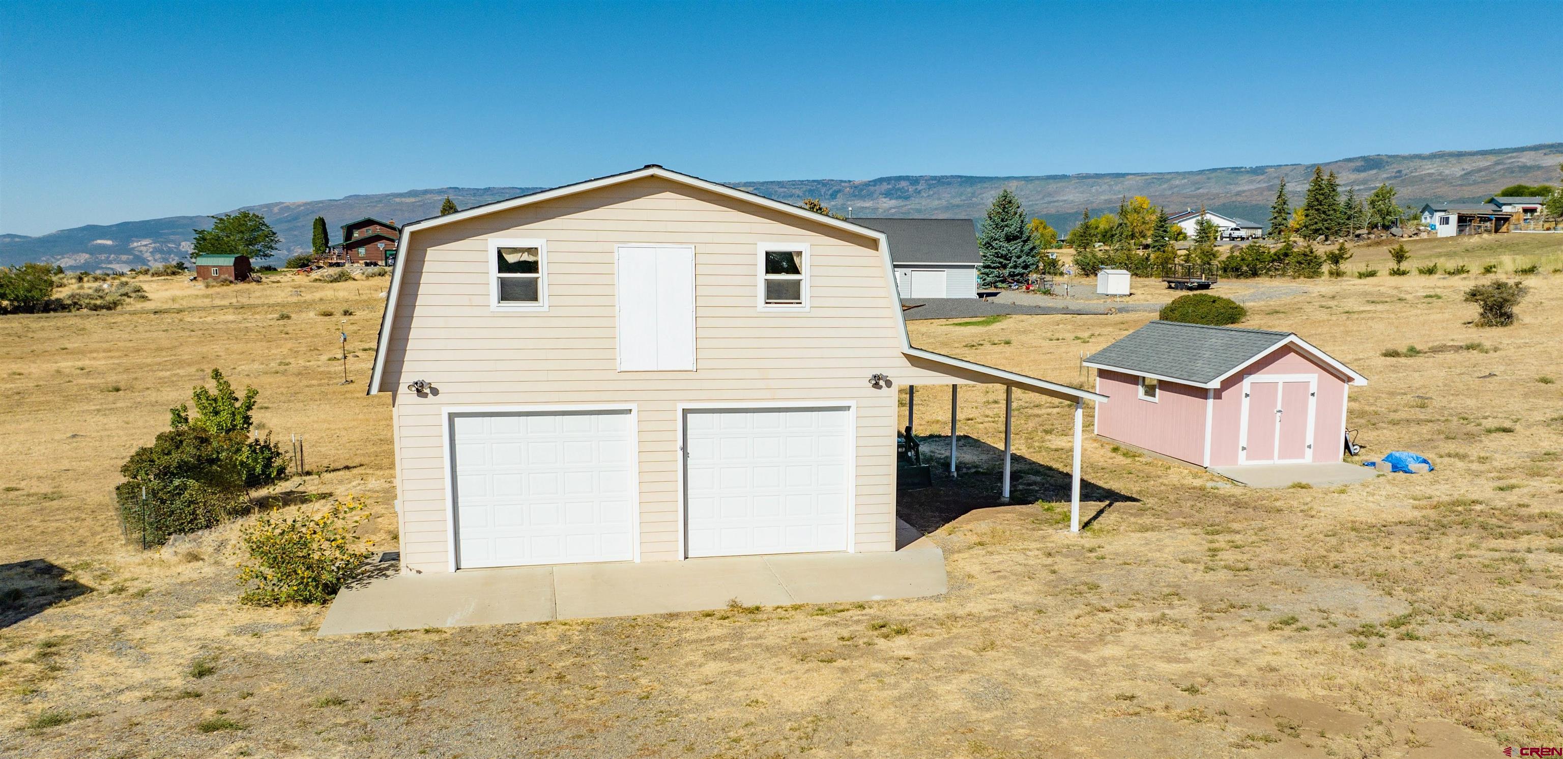 18641 2375th Road Cedaredge, CO 81413 - Photo 30 of 35 a view of a house with a yard