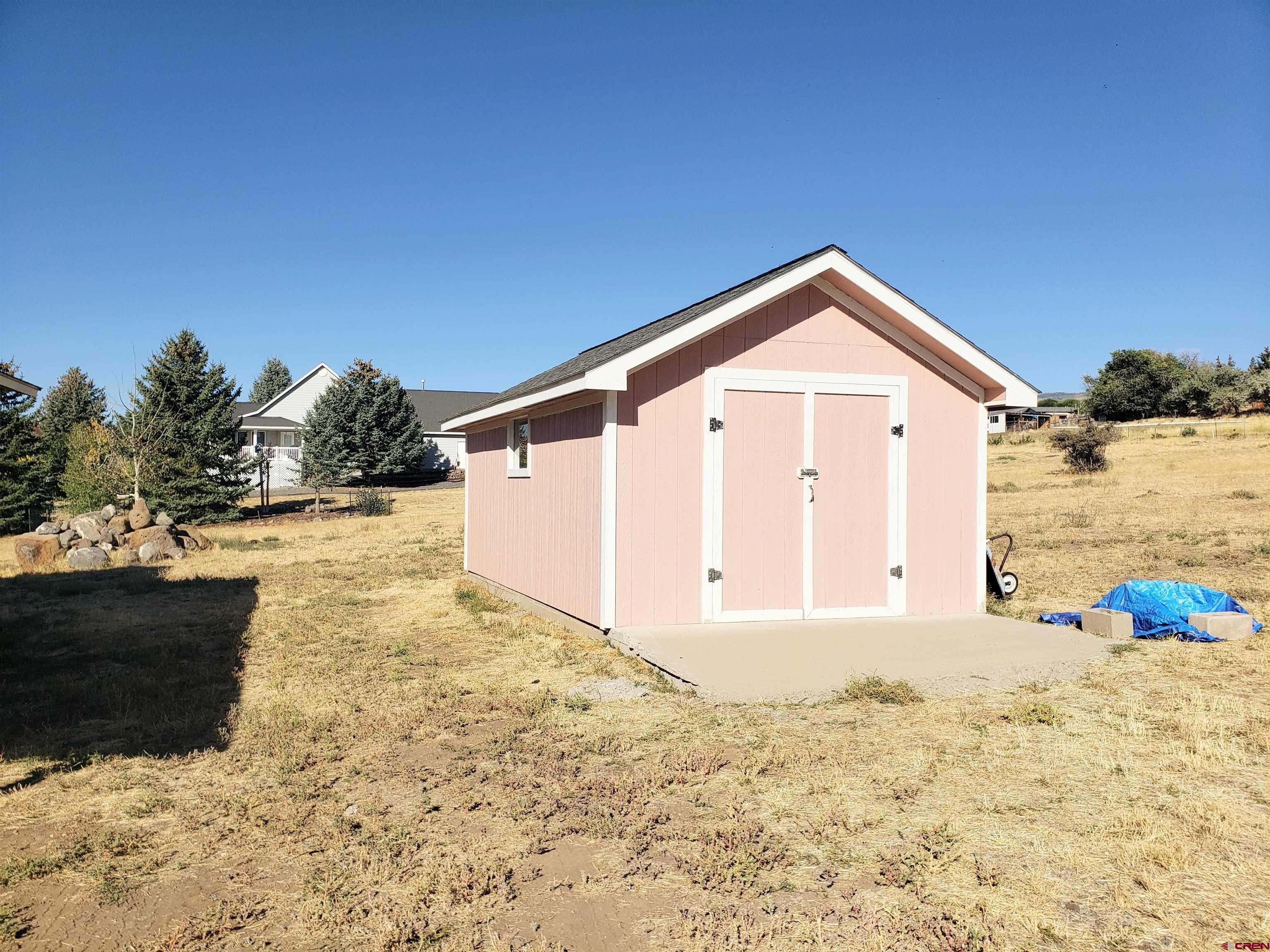18641 2375th Road Cedaredge, CO 81413 - Photo 34 of 35 a view of a house with a snow in the background