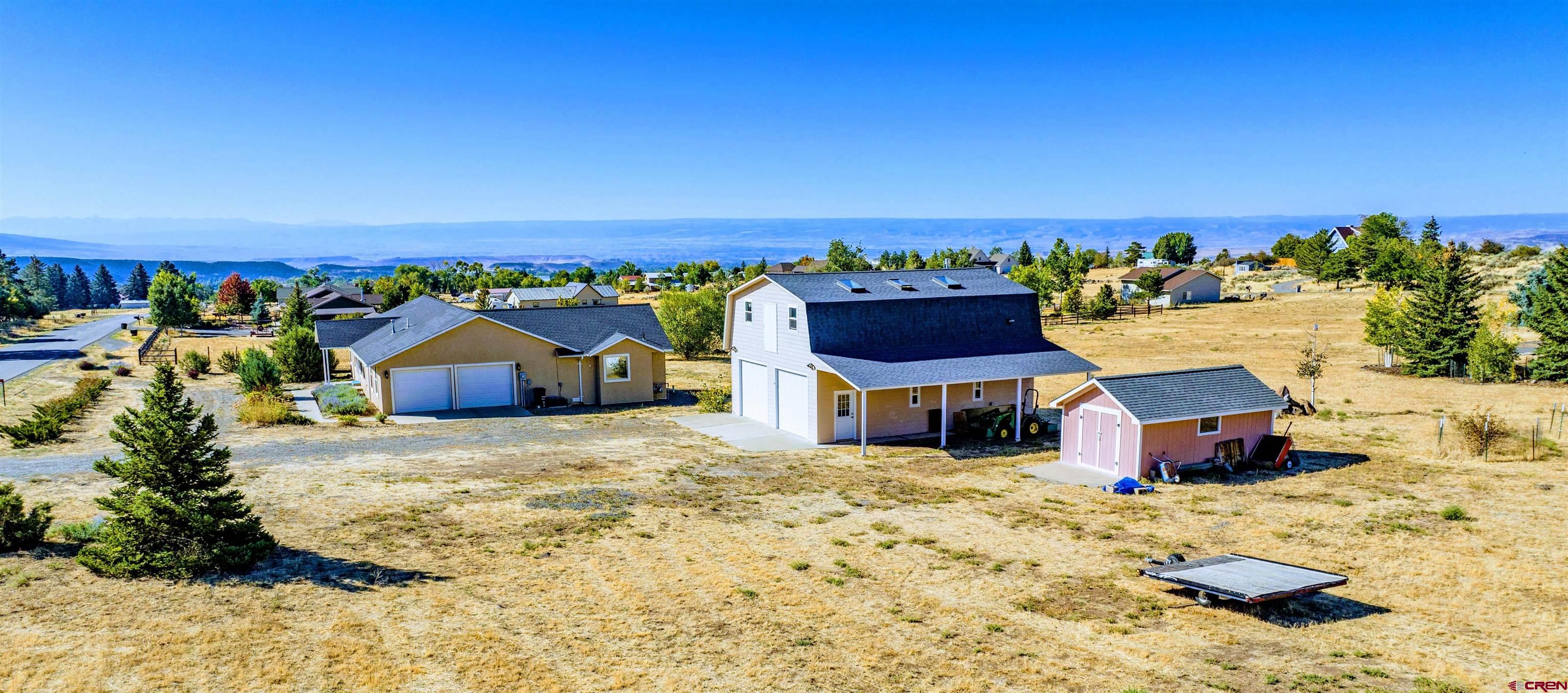 18641 2375th Road Cedaredge, CO 81413 - Photo 4 of 35 a front view of a house with a yard