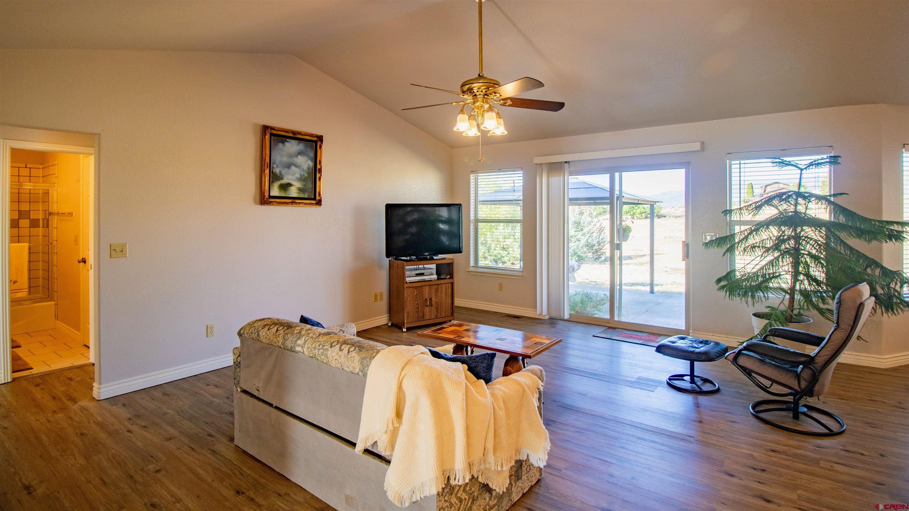 18641 2375th Road Cedaredge, CO 81413 - Photo 10 of 35 a living room with furniture and a flat screen tv