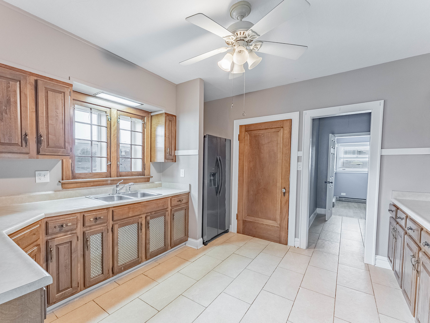 2246 Clinton Avenue Berwyn, IL 60402 - Photo 12 of 23 a spacious bathroom with a granite countertop sink a mirror and a shower