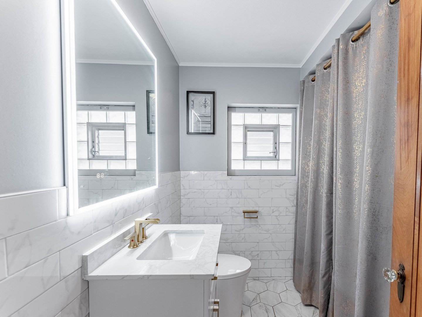 2246 Clinton Avenue Berwyn, IL 60402 - Photo 15 of 23 a bathroom with a sink toilet and shower