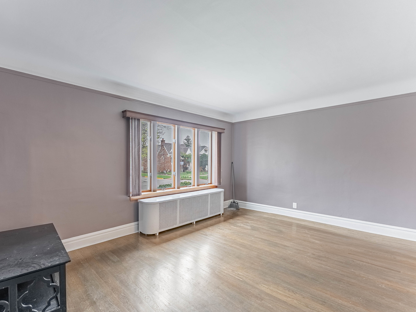 2246 Clinton Avenue Berwyn, IL 60402 - Photo 3 of 23 an empty room with wooden floor and windows