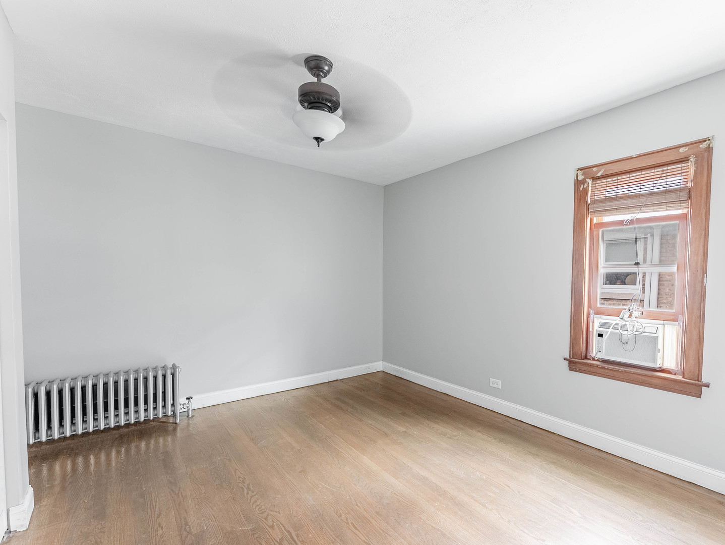 2246 Clinton Avenue Berwyn, IL 60402 - Photo 6 of 23 a view of an empty room with a window