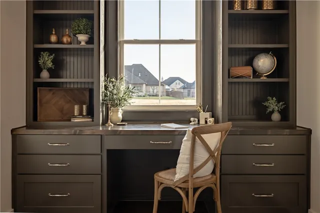 a room with a window and flowerpot