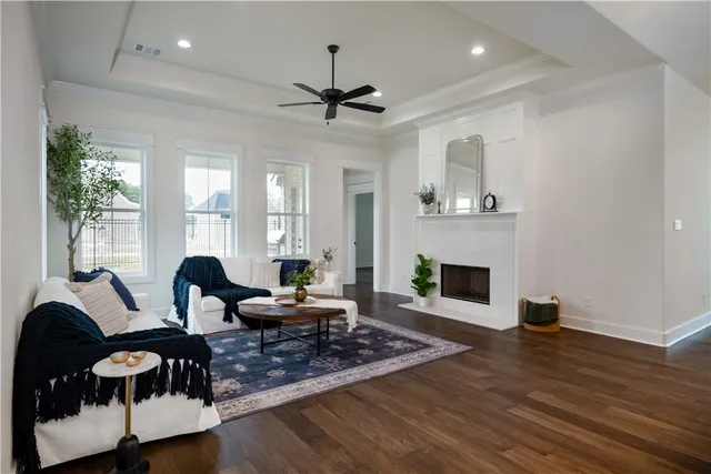 a living room with furniture and a fireplace