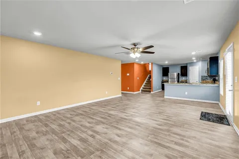 a view of a livingroom with a furniture and wooden floor