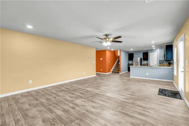 a view of a livingroom with a furniture and wooden floor