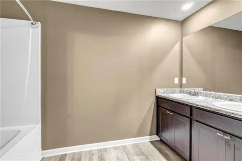 a room with a sink and a mirror