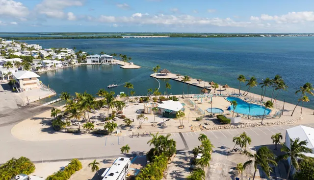 a view of a street with a cars parked in front of it