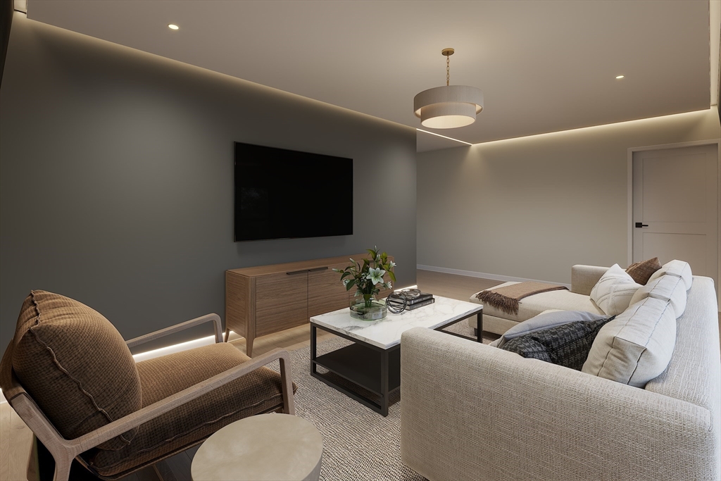 34 Governor Winthrop Road, Unit 2 Somerville, MA 02145 - Photo 16 of 23 a living room with furniture and a flat screen tv