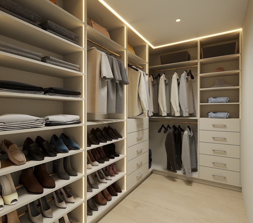 34 Governor Winthrop Road, Unit 2 Somerville, MA 02145 - Photo 18 of 23 a view of walk in closet with clothes and shoes