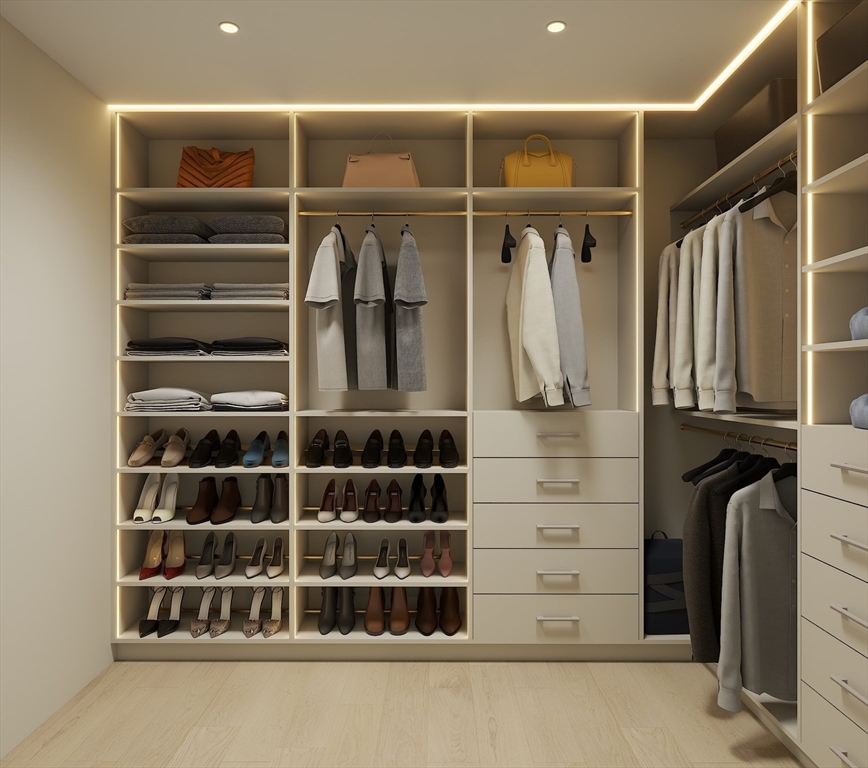 34 Governor Winthrop Road, Unit 2 Somerville, MA 02145 - Photo 19 of 23 a view of walk in closet with clothes and shoes