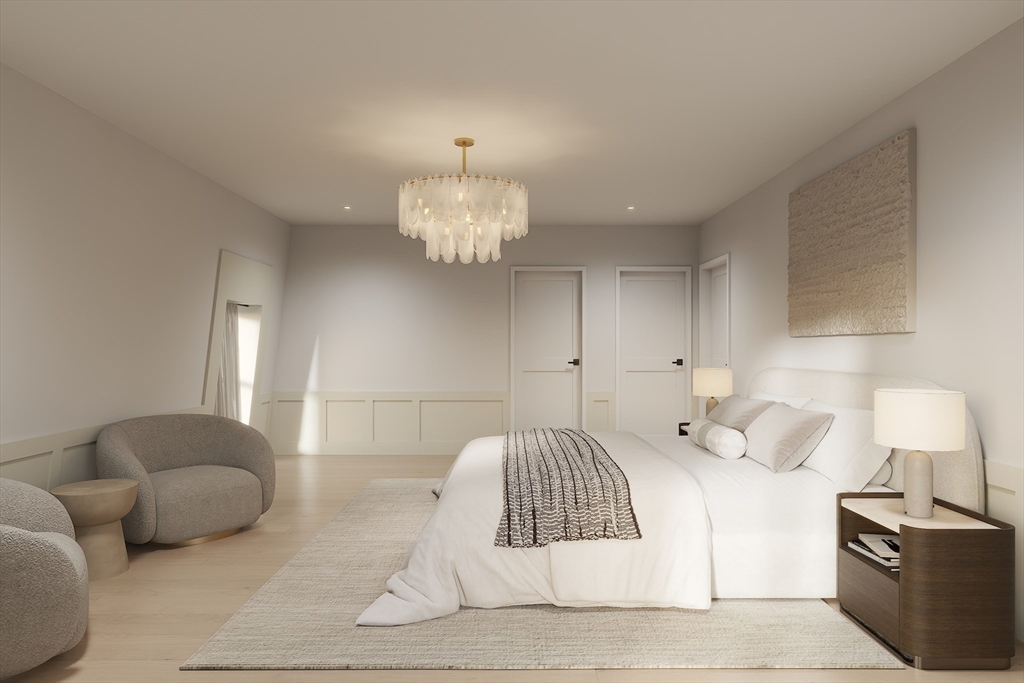 34 Governor Winthrop Road, Unit 2 Somerville, MA 02145 - Photo 20 of 23 a bedroom with a bed and a chandelier