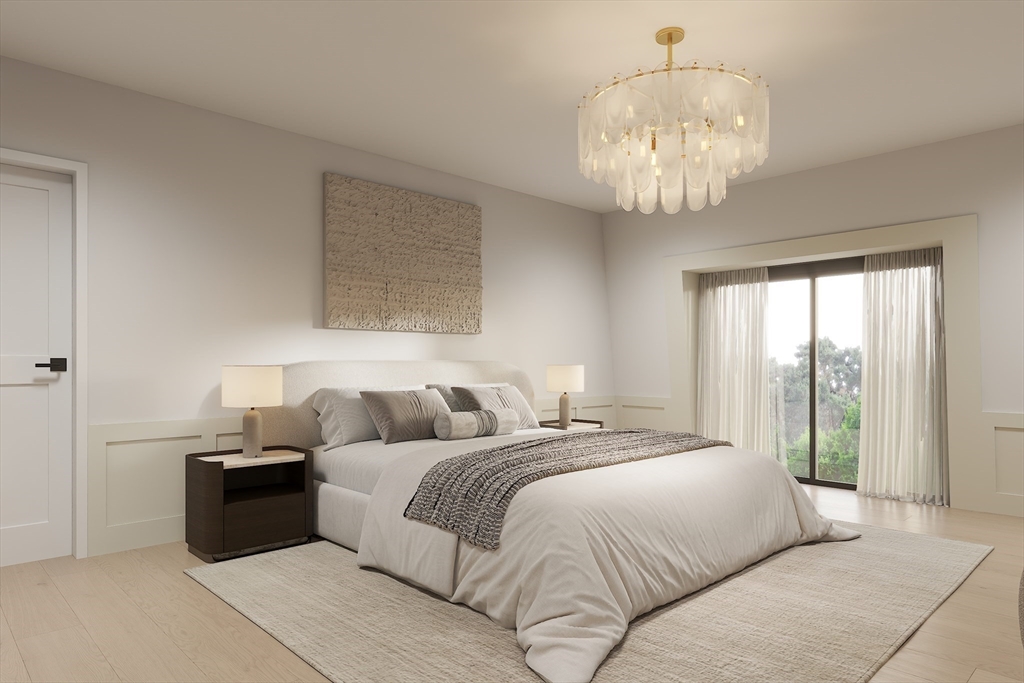 34 Governor Winthrop Road, Unit 2 Somerville, MA 02145 - Photo 21 of 23 a bedroom with a large bed and a chandelier