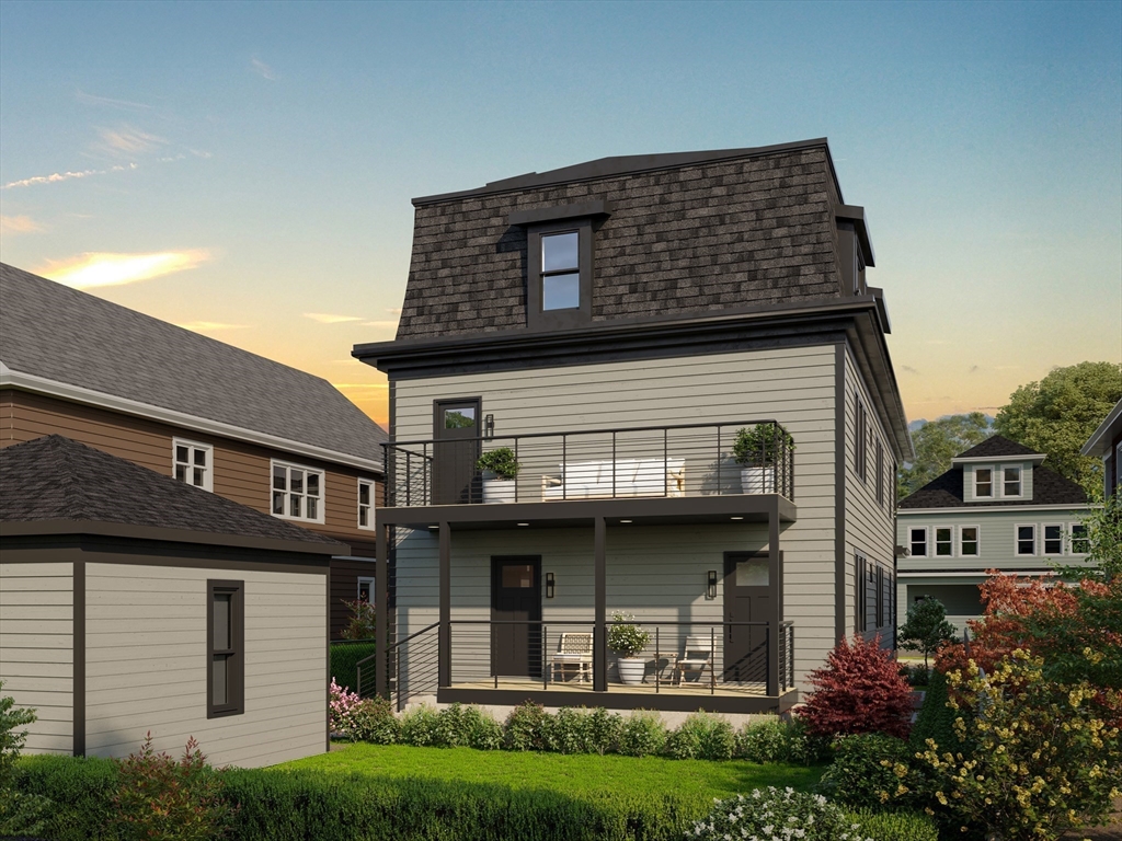 34 Governor Winthrop Road, Unit 2 Somerville, MA 02145 - Photo 3 of 23 a front view of a house with a garden