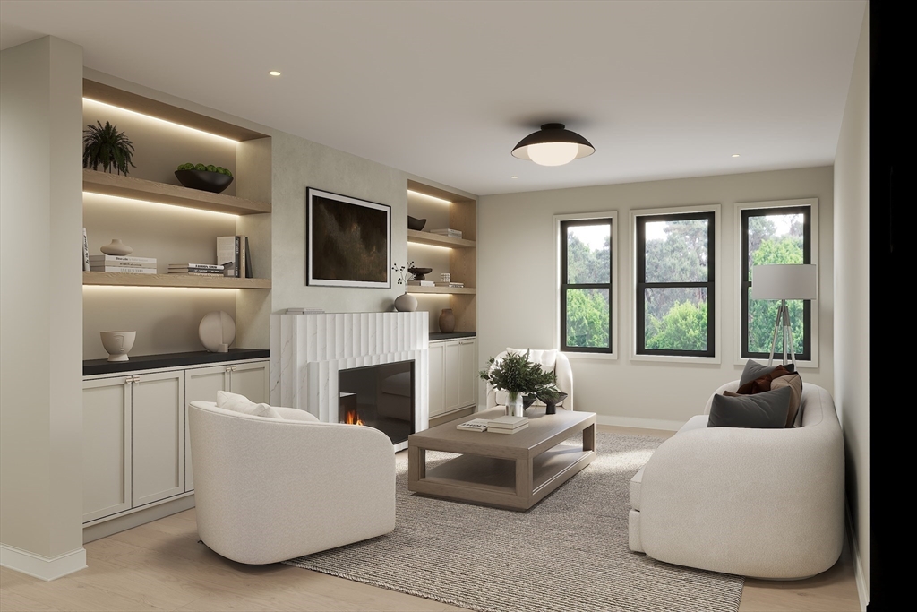 34 Governor Winthrop Road, Unit 2 Somerville, MA 02145 - Photo 7 of 23 a living room with furniture a fireplace and a flat screen tv