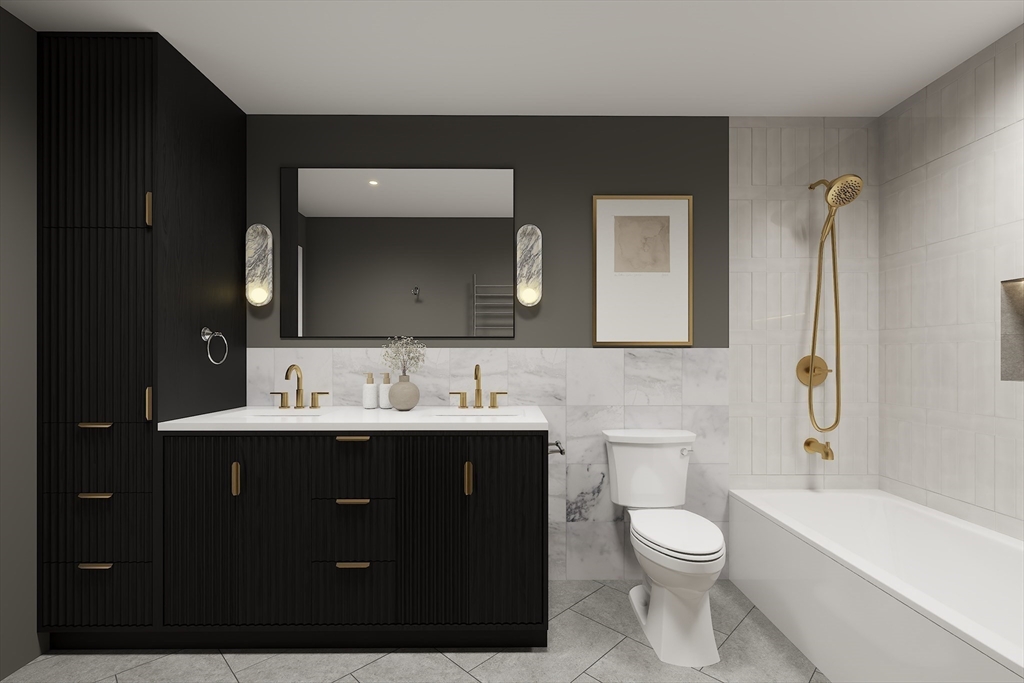 34 Governor Winthrop Road, Unit 2 Somerville, MA 02145 - Photo 10 of 23 a bathroom with a toilet sink double vanity and mirror