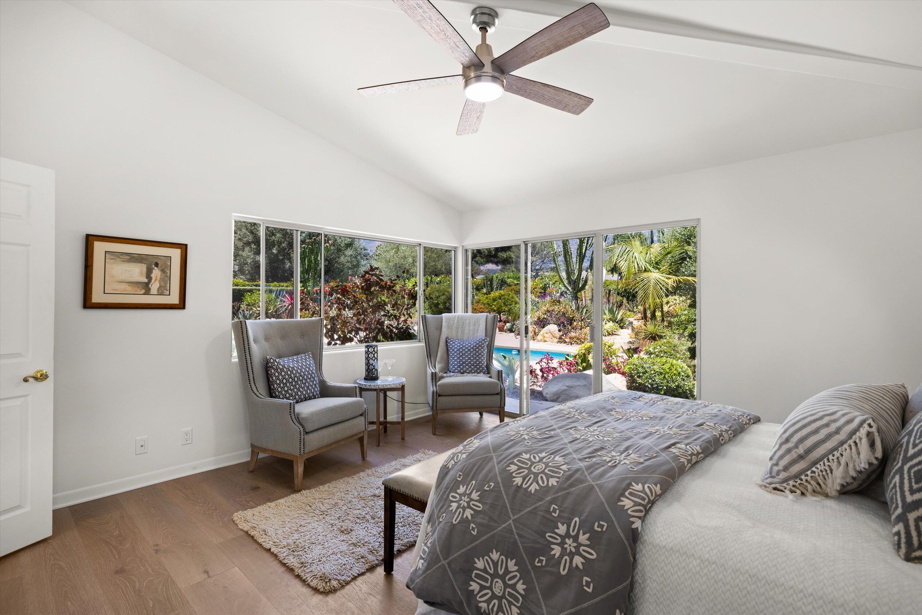 2150 10 Acre Road Montecito, CA 93108 - Photo 12 of 26 a bedroom with a bed a couch and a large window