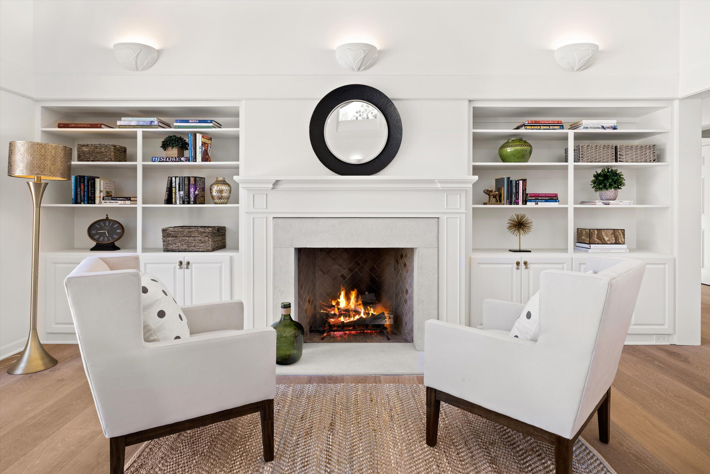 2150 10 Acre Road Montecito, CA 93108 - Photo 15 of 26 a living room with furniture a fireplace and a bookshelf