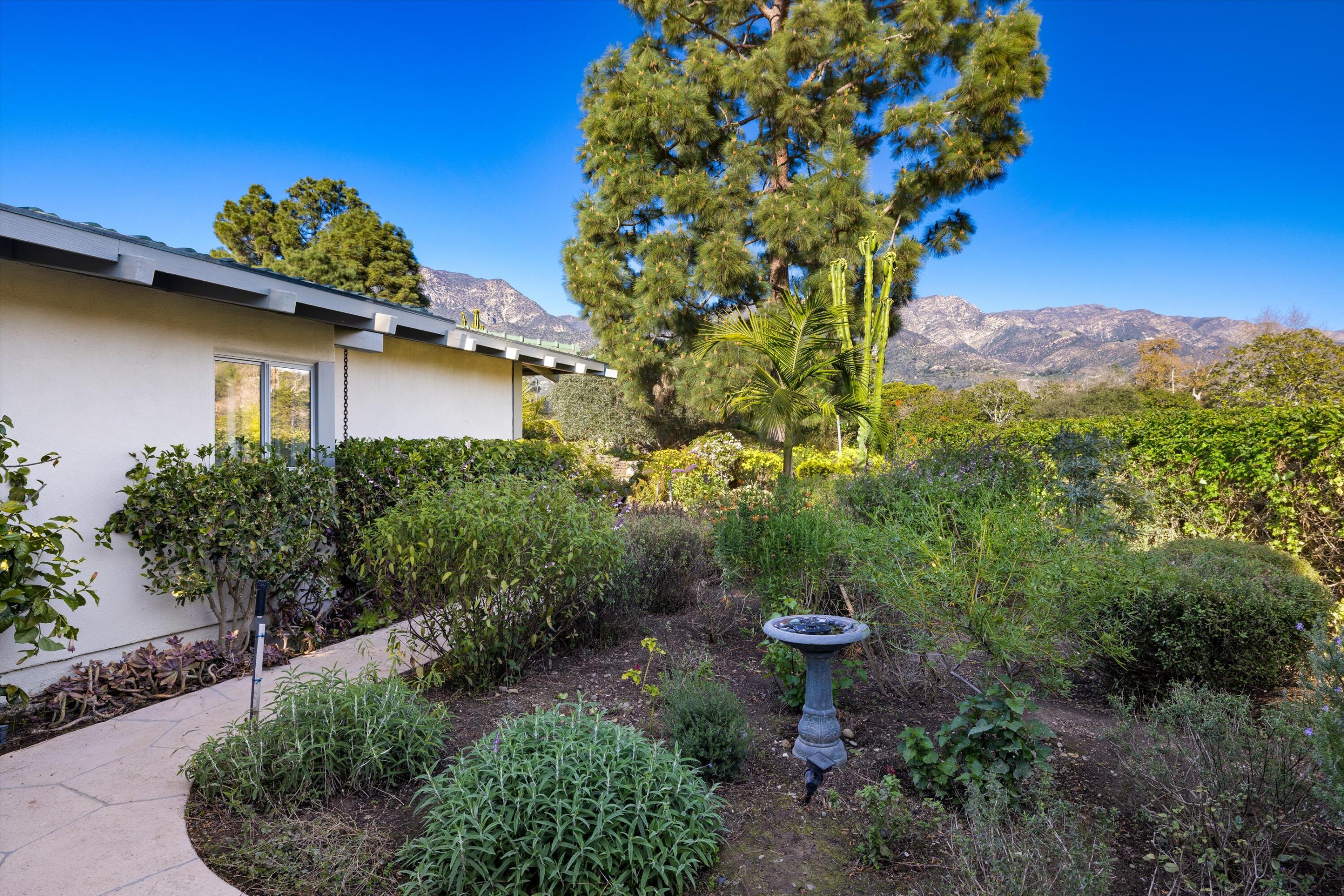 2150 10 Acre Road Montecito, CA 93108 - Photo 22 of 26 a backyard of a house with lots of green space