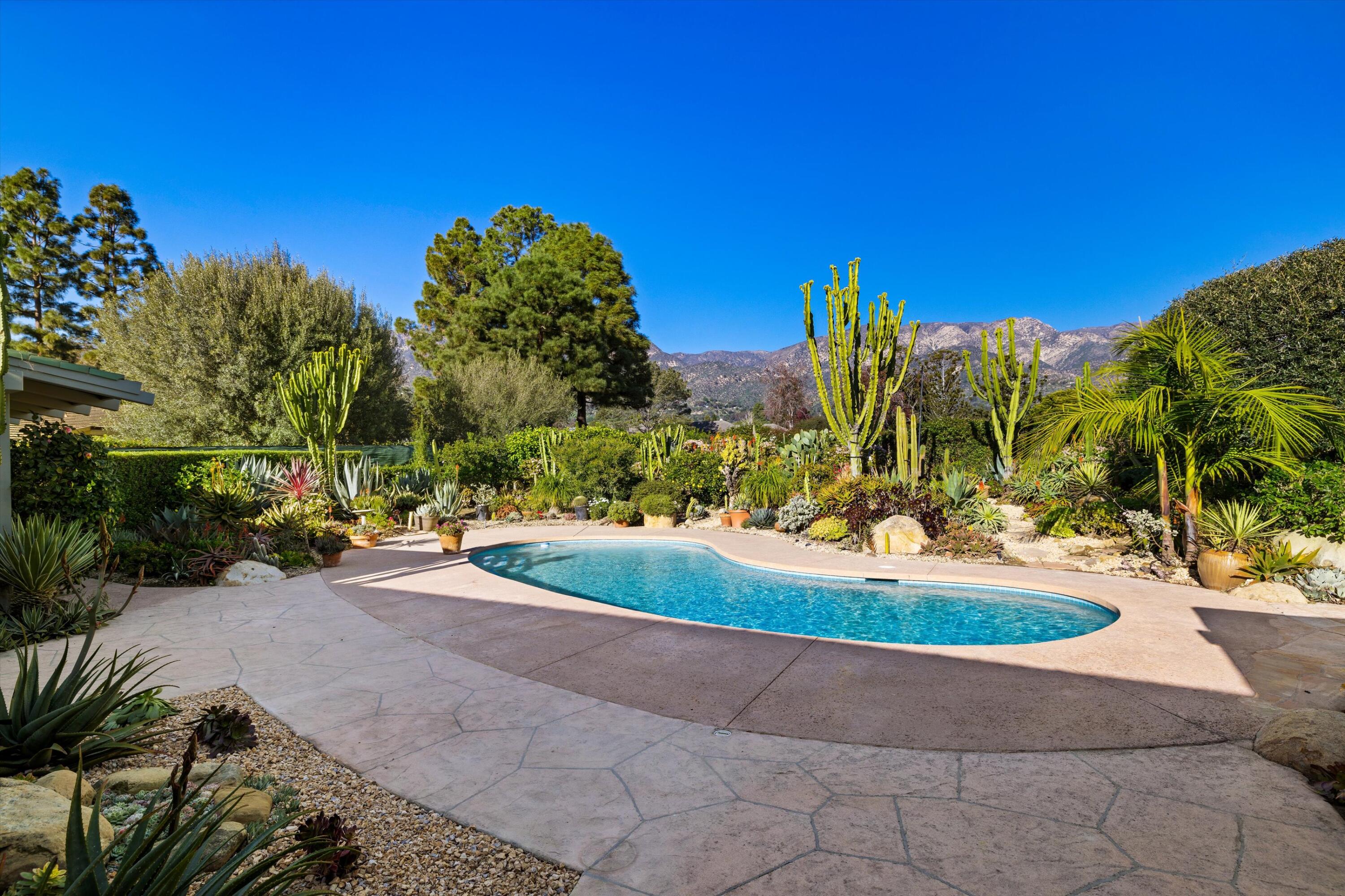 2150 10 Acre Road Montecito, CA 93108 - Photo 25 of 26 a view of a garden with a building in the background