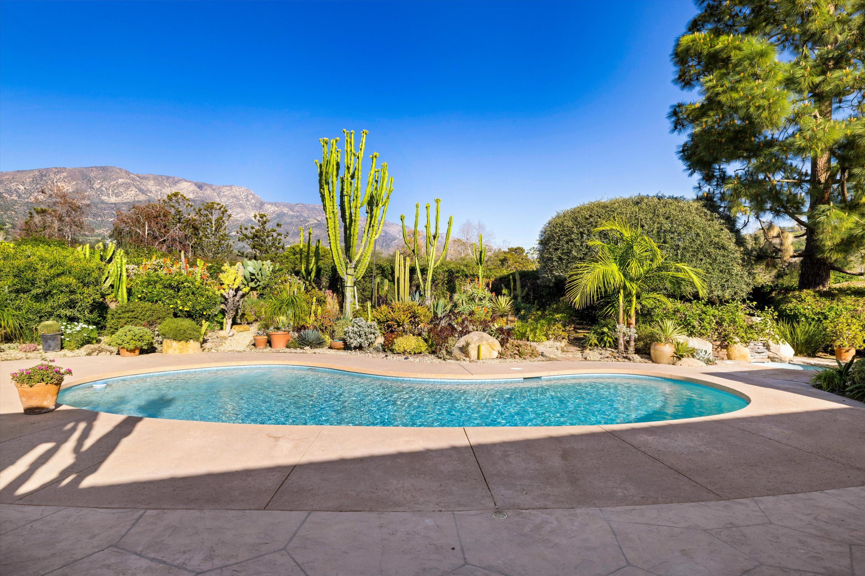 2150 10 Acre Road Montecito, CA 93108 - Photo 26 of 26 a view of a garden with a bench