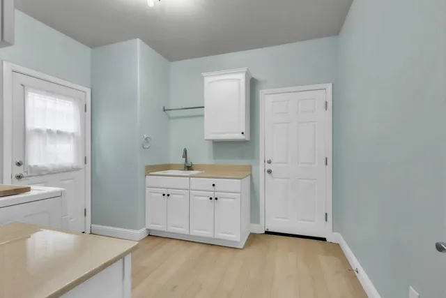 a bedroom with furniture and a wooden floor