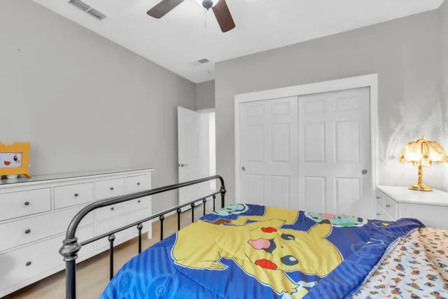 a bedroom with a bed and a closet