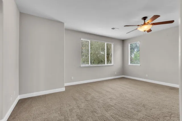 a bathroom with a sink a mirror and a shower