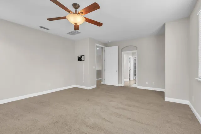 a bathroom with a double vanity sink toilet and shower