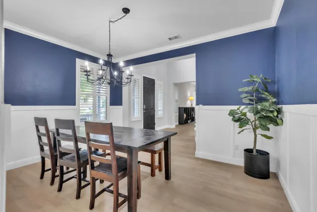 a view of a dining room with furniture and window