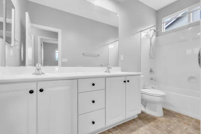 a view of workspace with furniture and a window