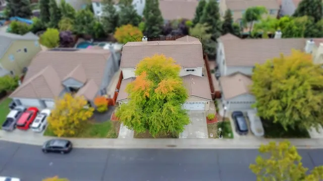 an aerial view of a house with a garden