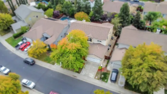 an aerial view of house with yard