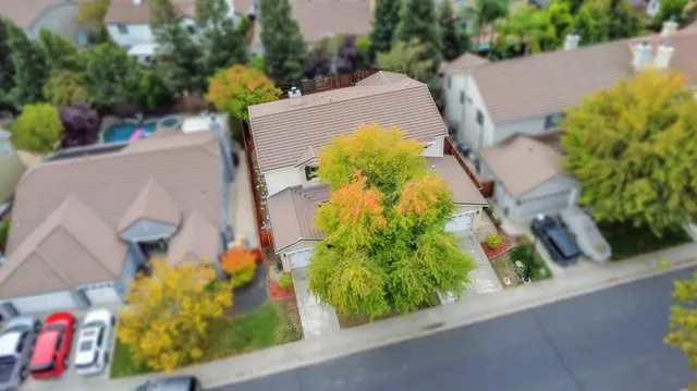 an aerial view of beach and residential space with swimming pool