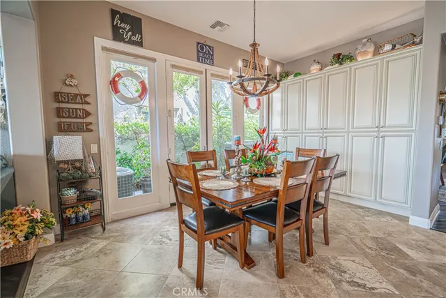 a kitchen with stainless steel appliances granite countertop a sink and a refrigerator