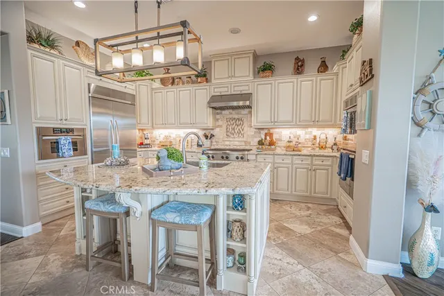 a living room with furniture floor to ceiling window and wooden floor