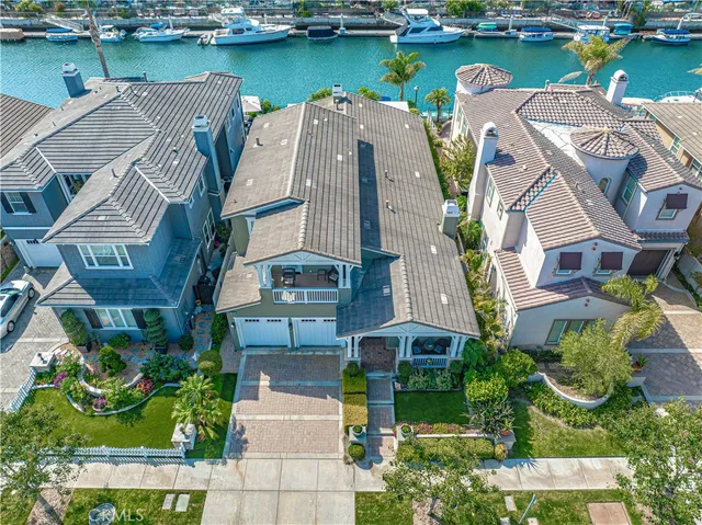 an aerial view of a house with a lake view
