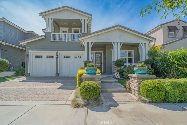 a living room with fireplace furniture and a large window