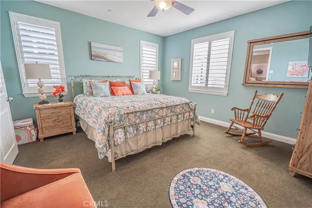 a view of a patio with couches and a potted plant