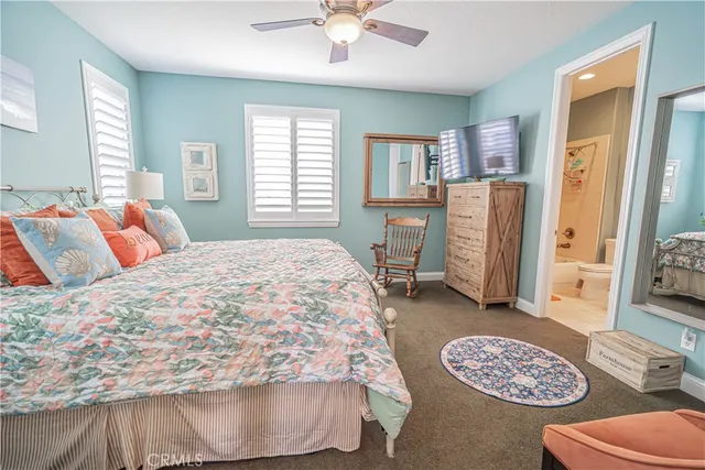 a view of a patio with table and chairs potted plants and palm tree