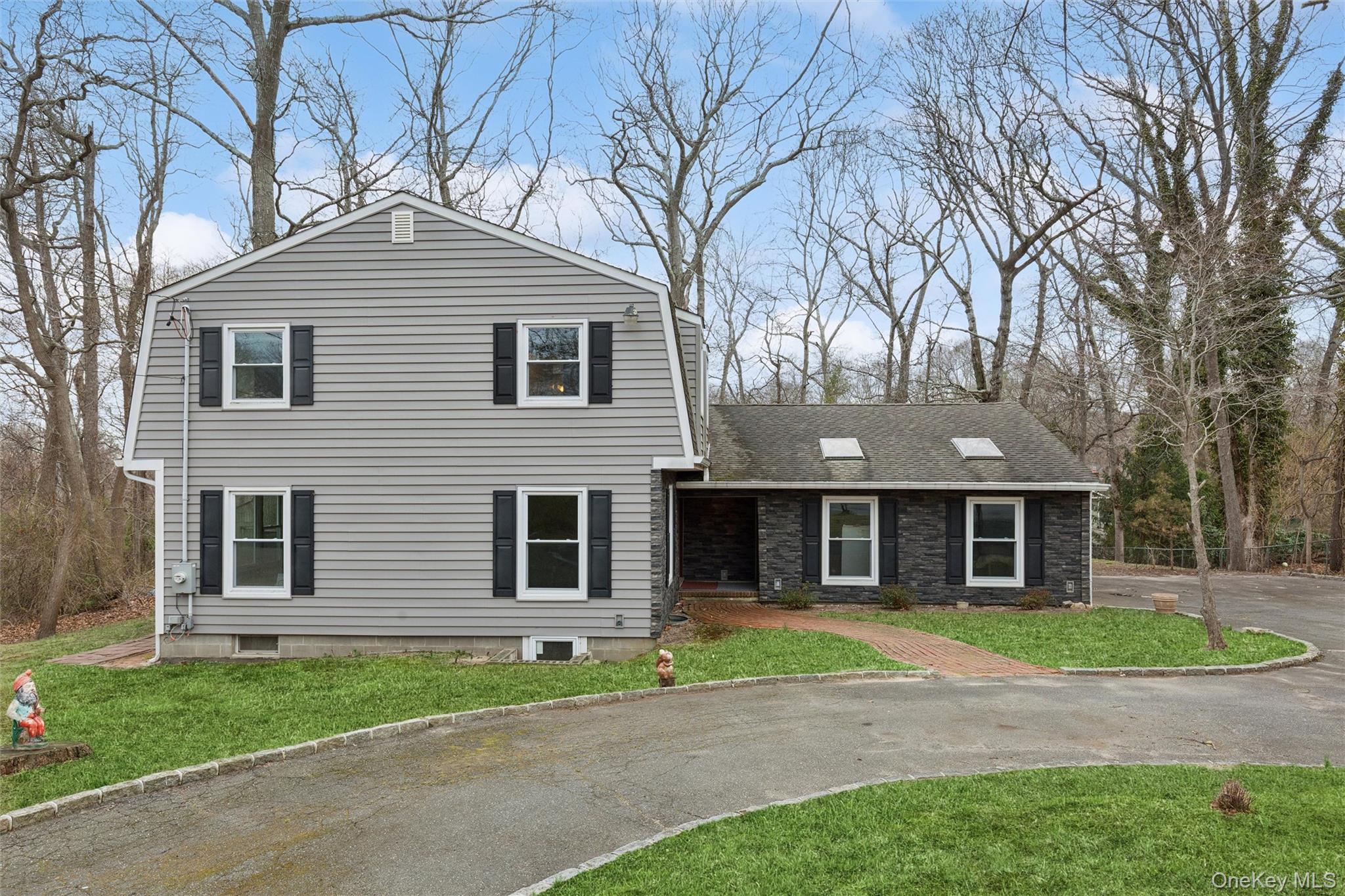 49 Overhill Road Wading River, NY 11792 - Photo 2 of 27 a front view of a house with a yard