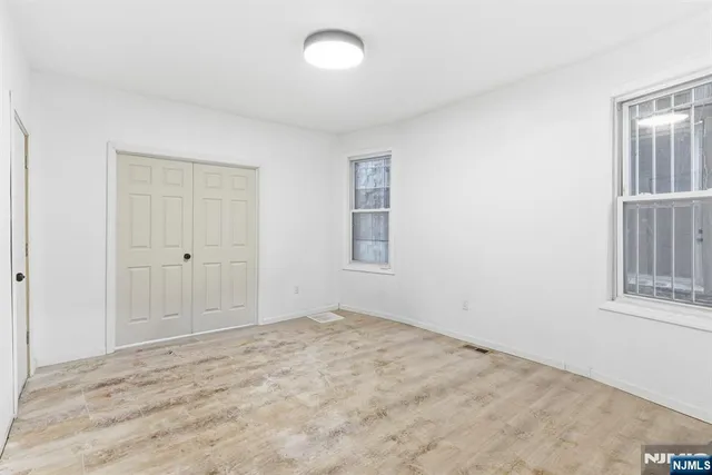 a kitchen with a refrigerator sink and cabinets