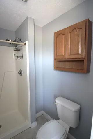 a white toilet sitting next to a bathroom sink
