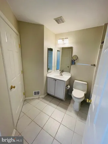 a bathroom with a sink a toilet and a bathtub