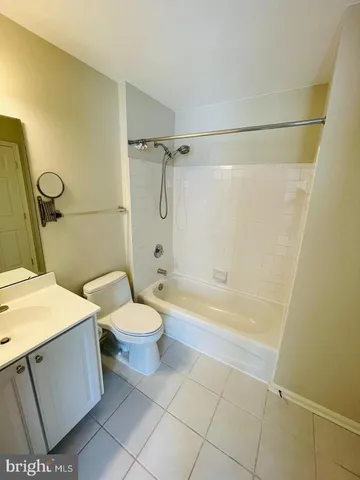 a view of a livingroom with wooden floor and a staircase