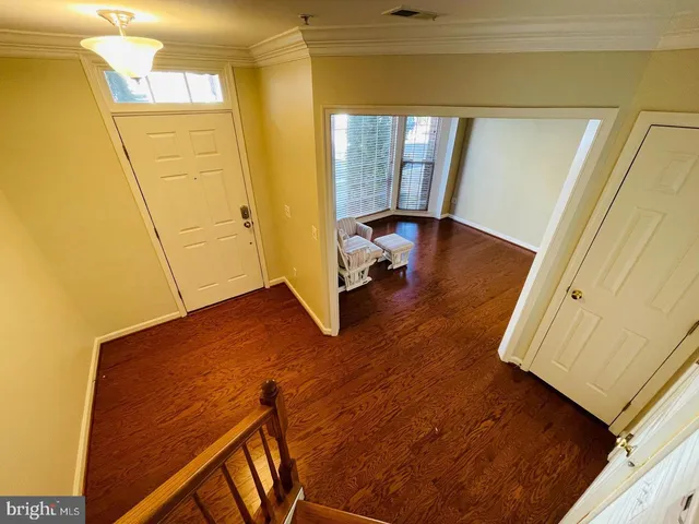 a living room with a bed furniture and a window