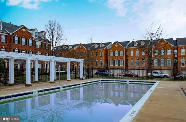a view of a yard with a house and a tree