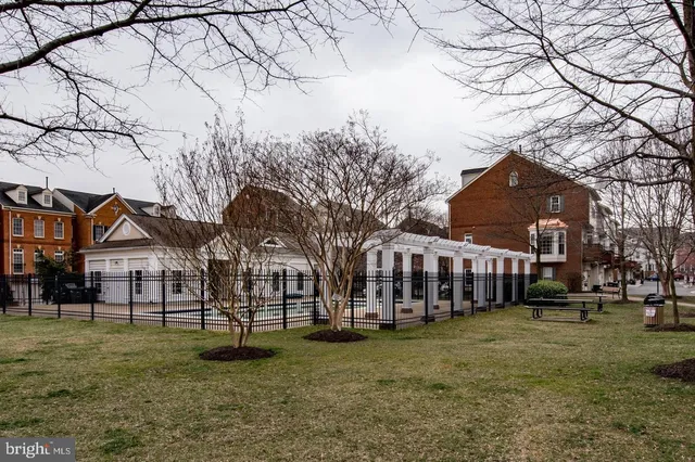 a view of a patio with table and chairs and potted plants